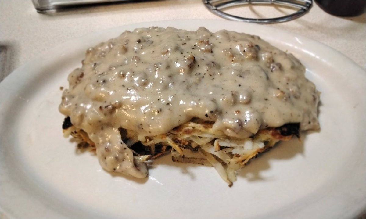 RoadRunner_4's tweet photo. Hashbrowns home cut folded in egg with cheese browned both sides and topped with sausage gravy https://t.co/YOLlM01SmX