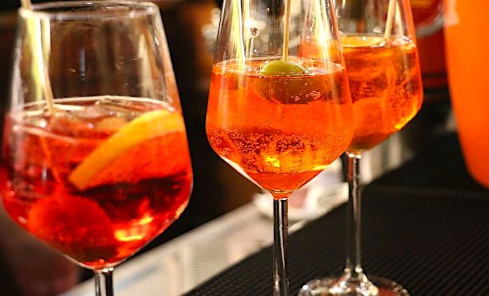 TaNootar's tweet photo. Spritz - Authentic Dishes And Drinks To Try In Italy

- Today, you can order a spritz anywhere in Italy. However, this light aperitivo originates in the Veneto region. In the 1800s, during the Hapsburg reign over the Veneto region, the Austrian soldiers were neither used to the wide selection or the strength of the wine as in Italy.

- So, they would ask the bartenders to spray (spritzen in German) some water into the wine to weaken it a bit. They added some sparkling water to a glass of white or red wine.