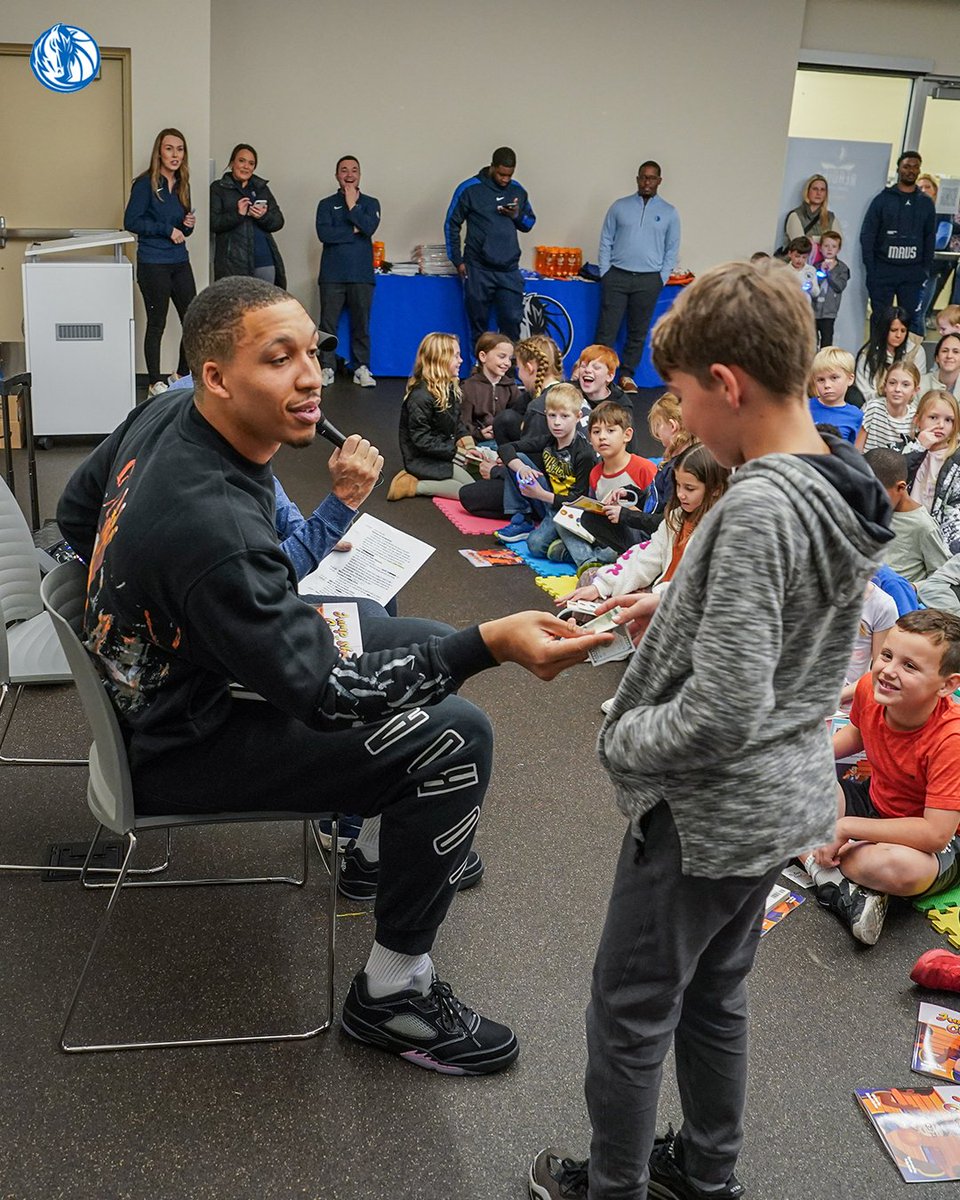 MavsOffCourt's tweet photo. As part of our Mavs Reading Challenge presented by @Whataburger  our guy @Grant2Will  joined students for a Mavs Reading Timeout at the Forest Green Dallas Public Library 📚

Students received two books to read along and goodies from the Mavs and Whataburger. #MFFL https://t.co/DTt5KE0FvP
