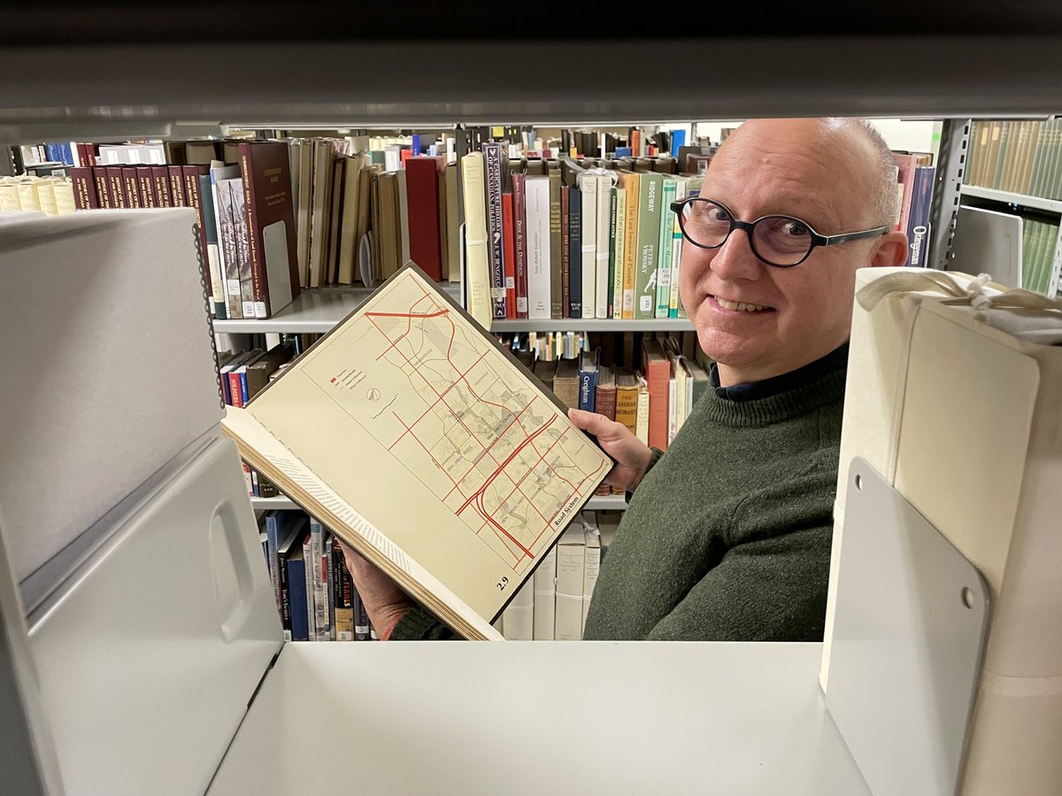 ArchivesOntario's tweet image. For #LibraryShelfieDay, our Librarian (and avid map fan) Frank is sharing one of his favourite books from our library: "Erin Mills New Town: A Proposal" (1969), full of fascinating plans and maps of this booming region just west of Toronto: ow.ly/7McN50QjeEa.