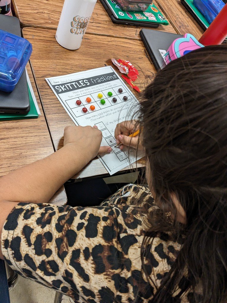 Ms. Green's 2nd graders learned about fractions of a set using Skittles! Students sorted their Skittles, then wrote fractions based on their set!