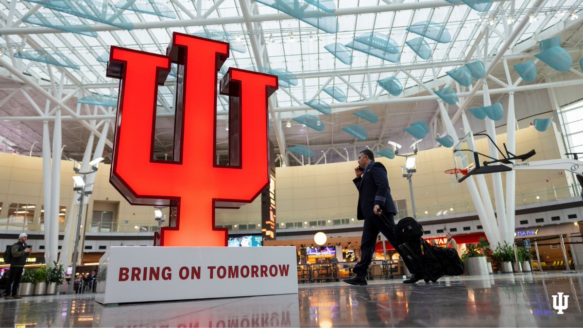 IndianaUniv's tweet photo. Flying out of @INDAirport soon? Be sure to take a photo with the IU Trident! Serving as a bold representation of the national brand campaign, this installation will be at IND through the end of the year. #BringOnTomorrow https://t.co/da9JcjU3S7 https://t.co/46qAGUYUeQ