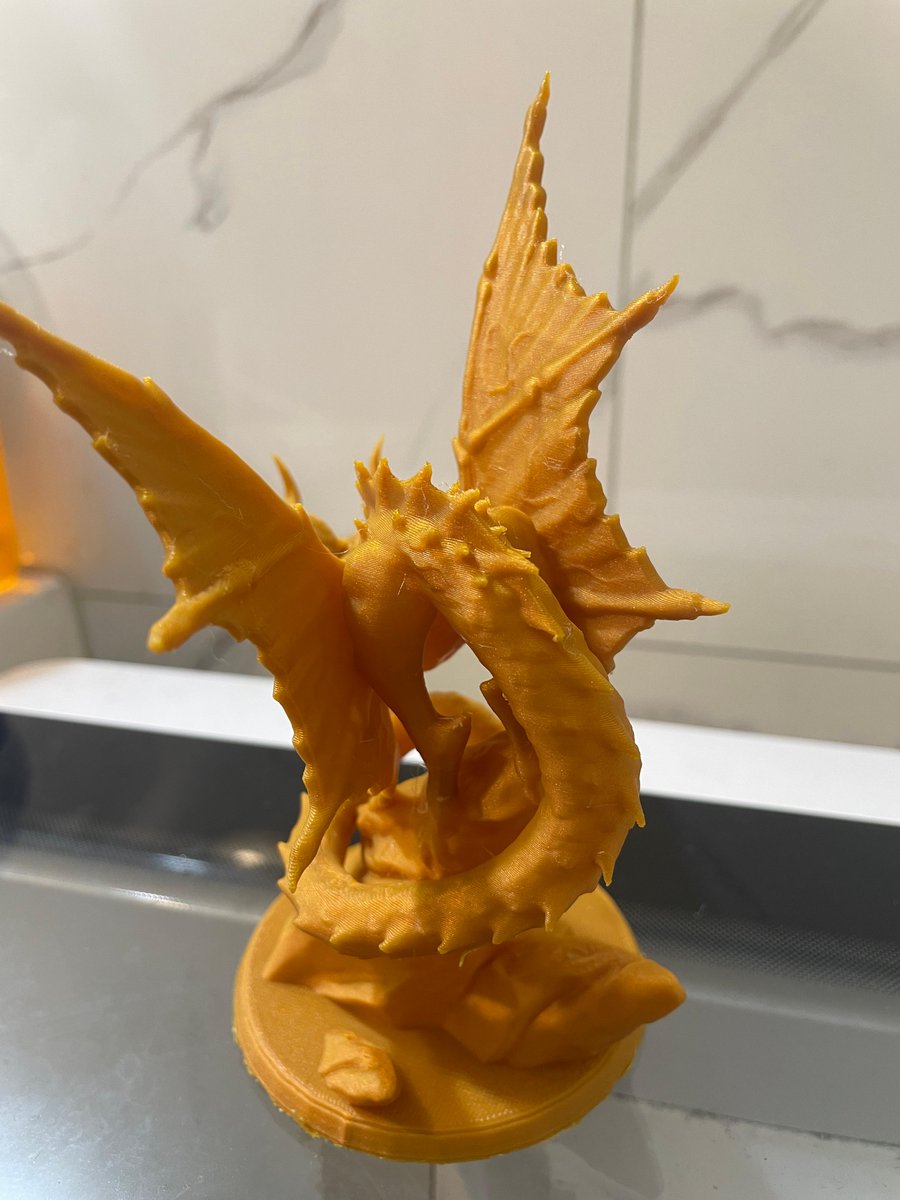 This yellow dragon was printed by our 3D Associate at the Yonkers, NY Micro Center store! Printed with Inland Shimmer Gold PLA STL Designed by miniShev and available from @thingiverse #inlandfilament #microcenter #3dprinting #3dprinted #filament