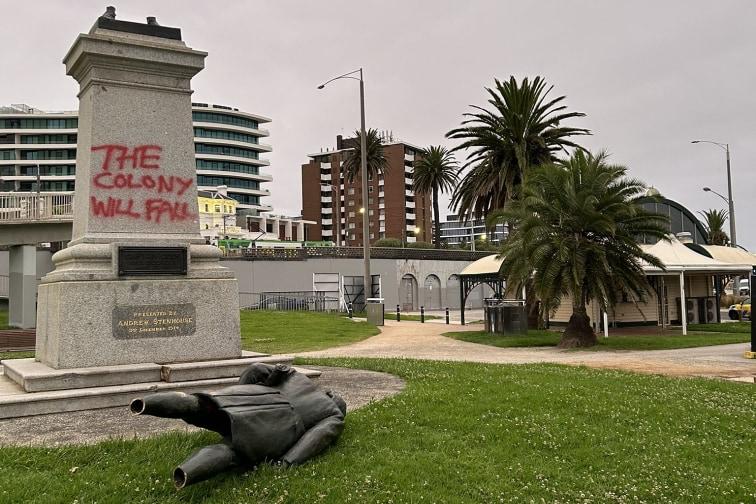  The statue of Colonizer Captain Cook in St Kilda, Melbourne toppled with "The colony will fall" spray painted on its concrete base. 