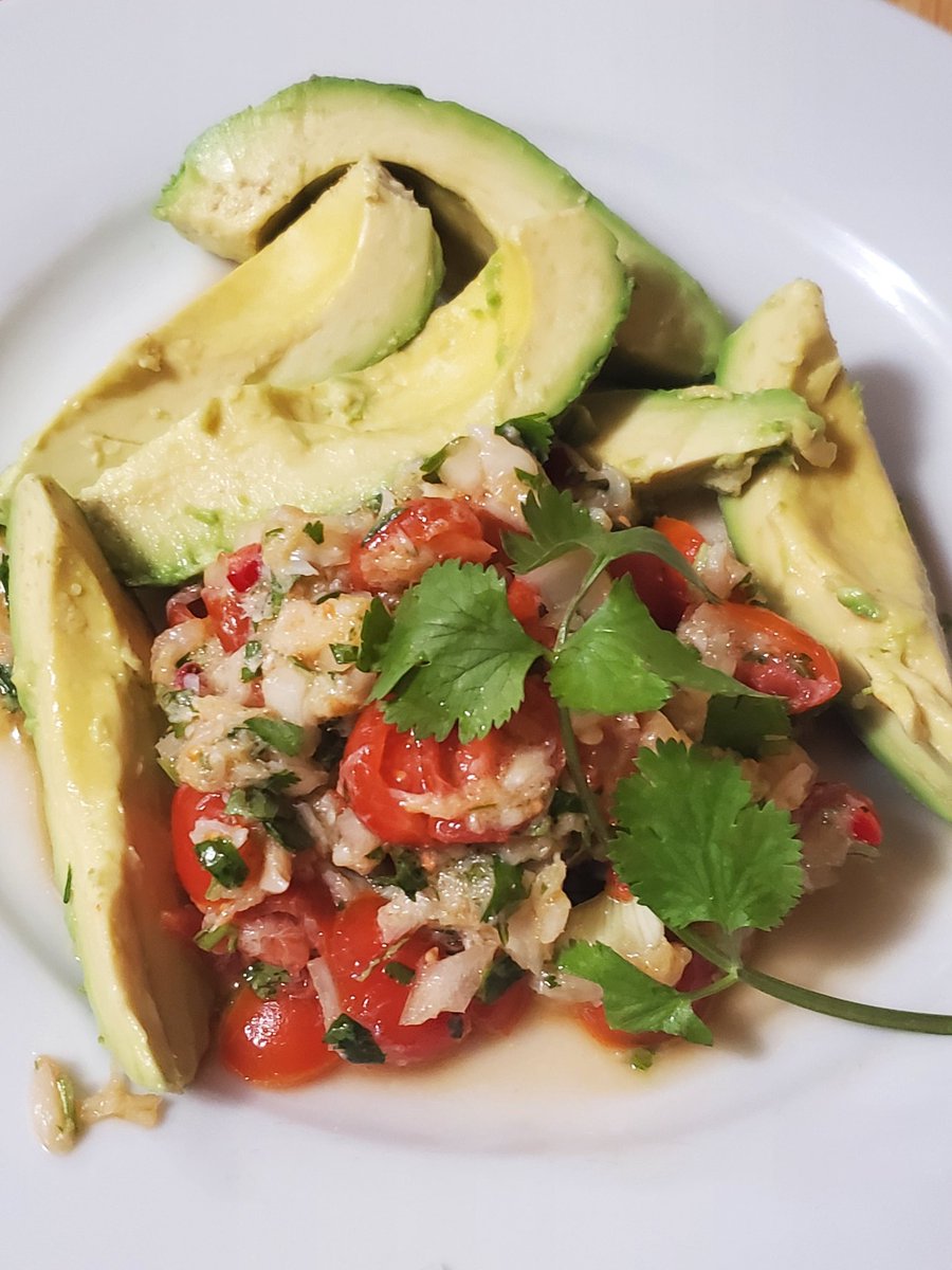 Bacalao/saltfish buljol with lots of sweet cherry tomatoes and avocado. That's what's for dinner.