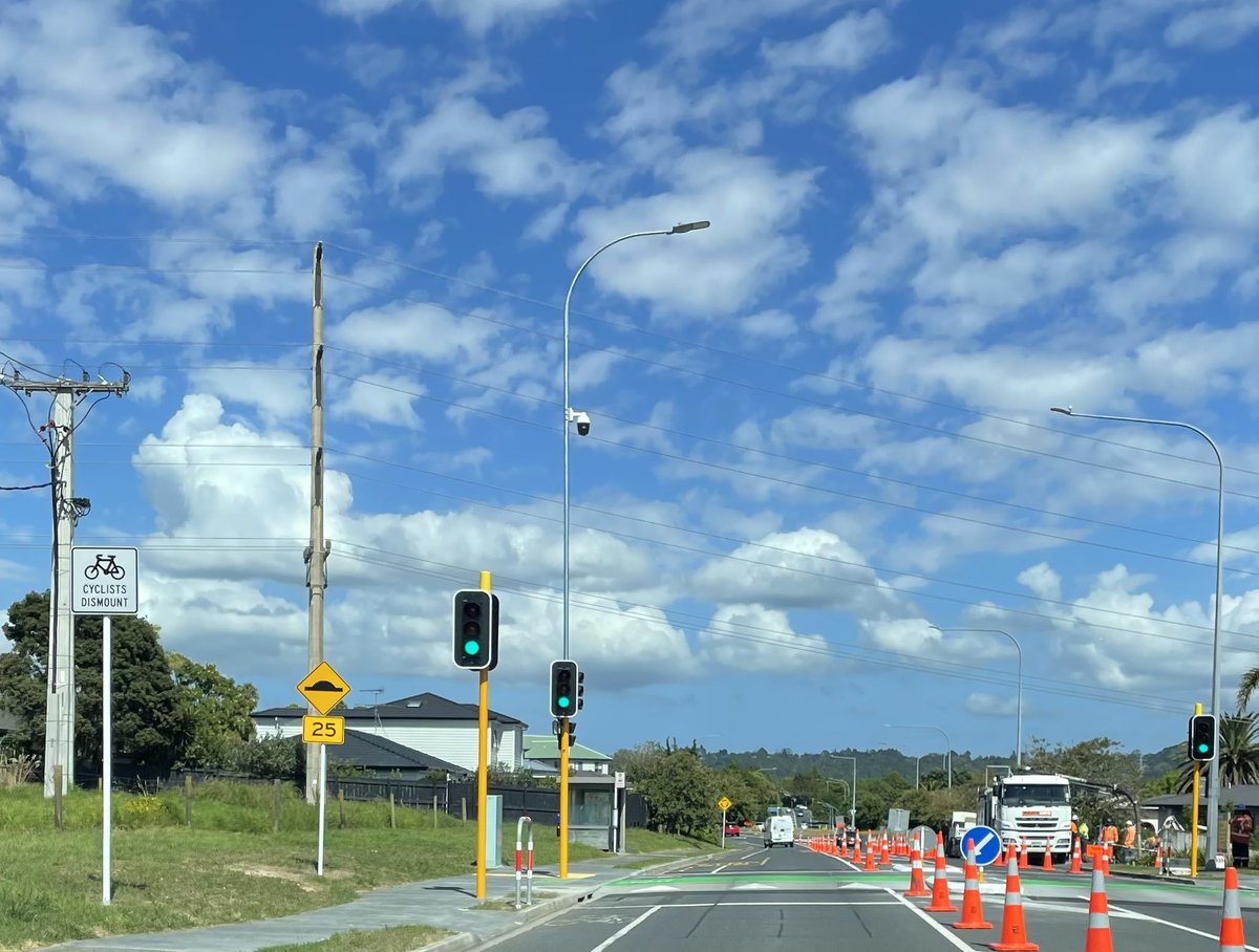 SolidGreyMatter's tweet photo. One of the best examples of Auckland Transport blowing tax payers money a road with very little people crossing they have installed a island, lights, signs, speed bump, cameras and now cyclists have to dismount making it dangerous. @SimeonBrownMP #auckland @BernardOrsman https://t.co/Tvc5t5amRh