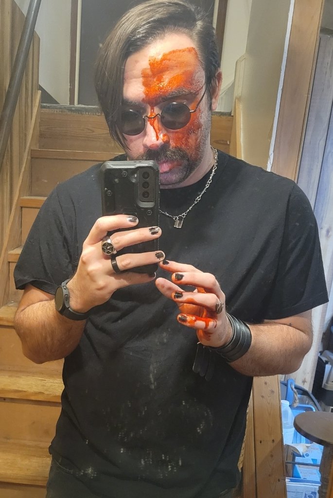 stephen29red's tweet photo. A year ago today I covered myself in fake blood, fully committed to the aggrotech bit, and took @twentyninered promo photos in the snow outside. 

And then I actually put out some music that year.. Which is a better track record than all the other times I took promo photos lmao https://t.co/xi2sprEP0P