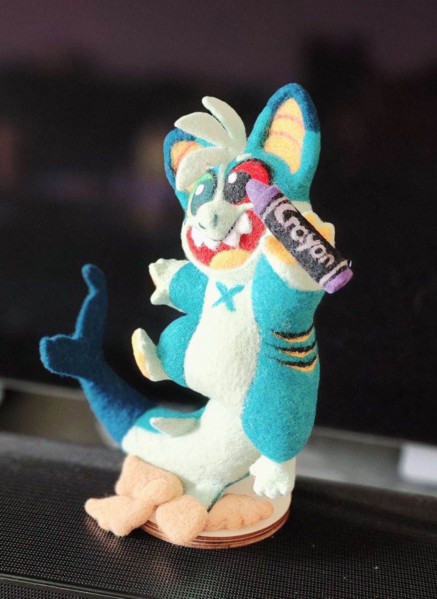 OMG LOOK AT HIM! Julune surprised me today with this Needle Felt Cork that she had commissioned for me!! He has a swappable magnetic crayon, and different shaped chicken nuggies! 🤩 🦈🖍️