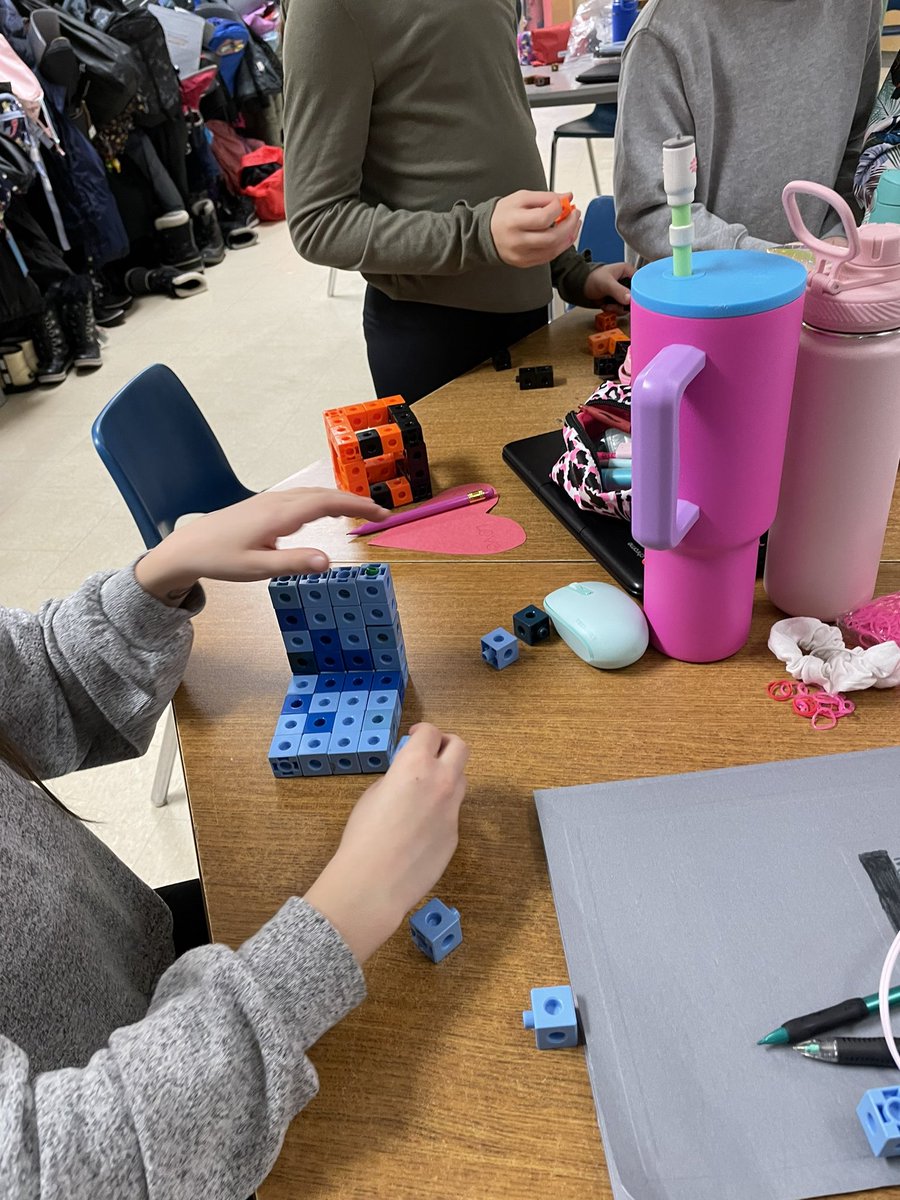 Students were so excited to start our new math unit in Geometric Reasoning! For lesson 1 we explored the different attributes between cubes and prisms comparing faces, vertices, and edges. In groups the students were challenged to create a Cube and a Prism their way! <a href="/StJohnPaul2/">St. John Paul II Catholic Elementary School</a>