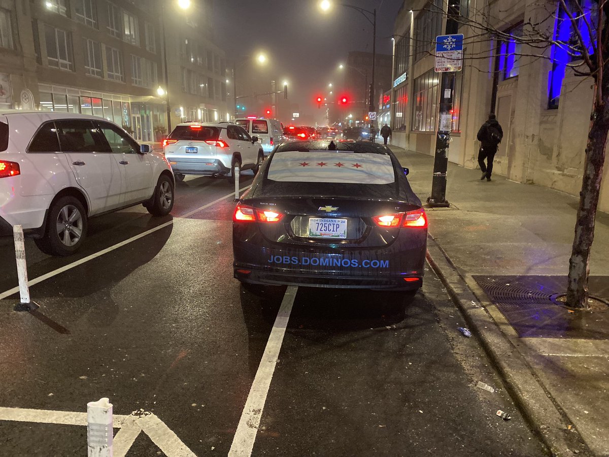 perhapsmartin's tweet photo. Hey @dominos , rather than putting a Chicago flag on your delivery vehicles, maybe explain to your drivers that parking on the bike lane is illegal in Chicago and kills bicyclists. 
#bikechi 
(So much for the effectiveness of flex posts) https://t.co/FYrWJaxGkD