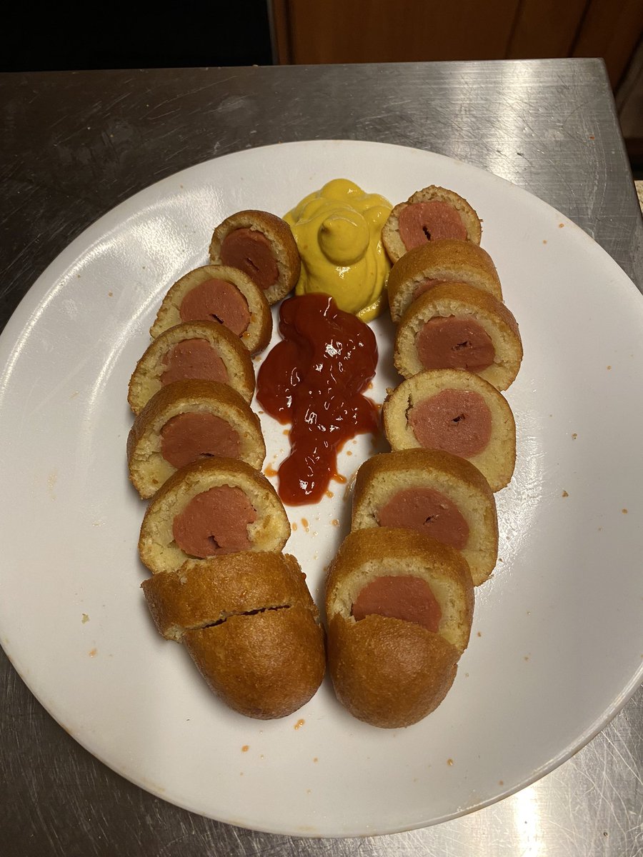 Hot dog Wellington with a tomato reduction and mustard seed sauce