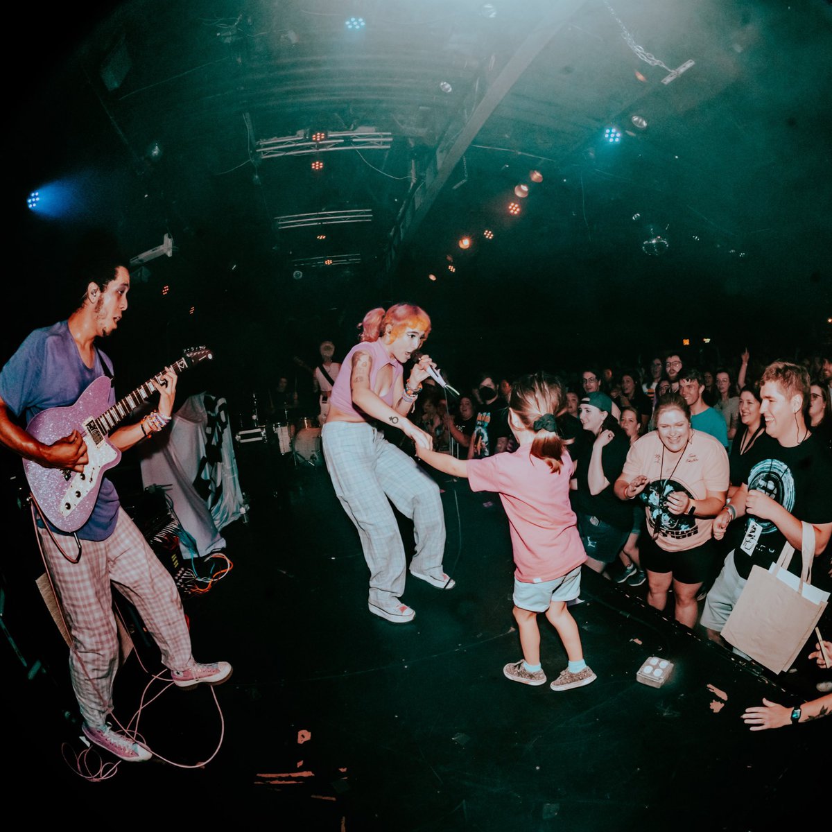 RissyRoo_13's tweet photo. @ArrowsInAction My favorite moment? Seeing @honeyrevengeca and @ArrowsInAction for the first time AND my very first concert EVER. Way to set the bar for any future concert. (Me in the 2nd row by the guy in green) 🩷🩷 https://t.co/XaNz4Z8kMl
