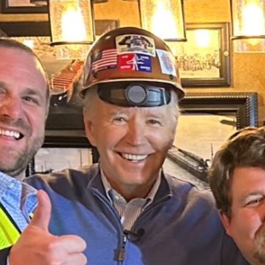 Jobe Biden has hard hat on backwards.