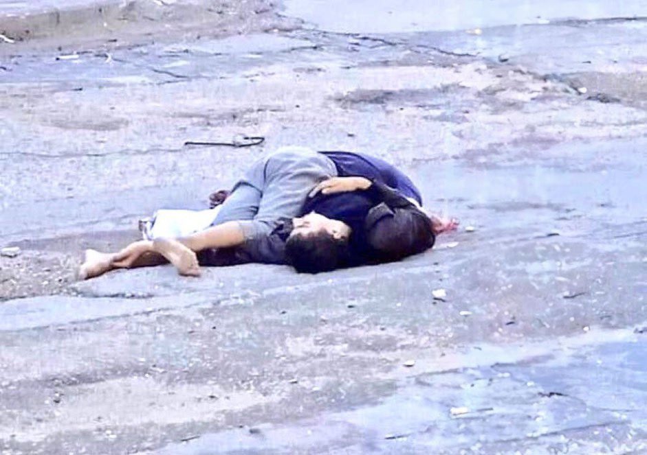 Israel sniper killed two Palestinian brothers Zahid &amp; Nahid in Gaza. Zahid with a white flag had gone scrounging for food then he was shot . Nahid, in Supreme act of pure love went to carry his dead brother. The sniper killed him too. If this photo of pure evil against innocent