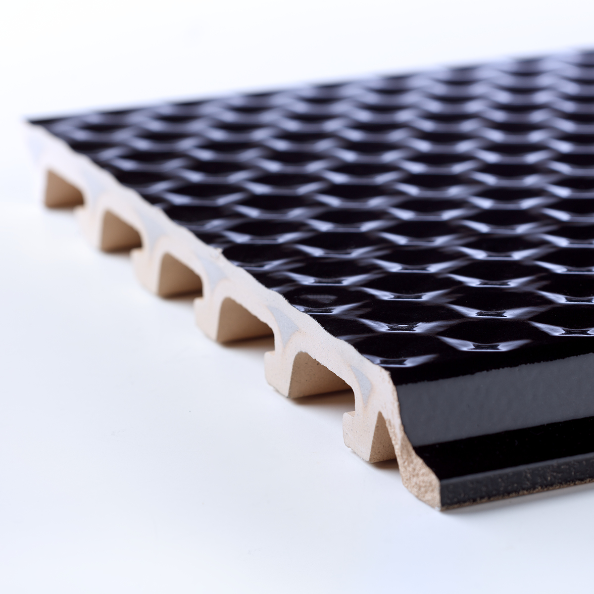 With TONALITY®, we developed and produced these ceramic tiles with creative 3D hexagon structures on complex cross sections. 
 
Do you want us to come to your production facility and showcase some of our ceramic lab test tooling in action? Get in touch at business@ztrusion.tech