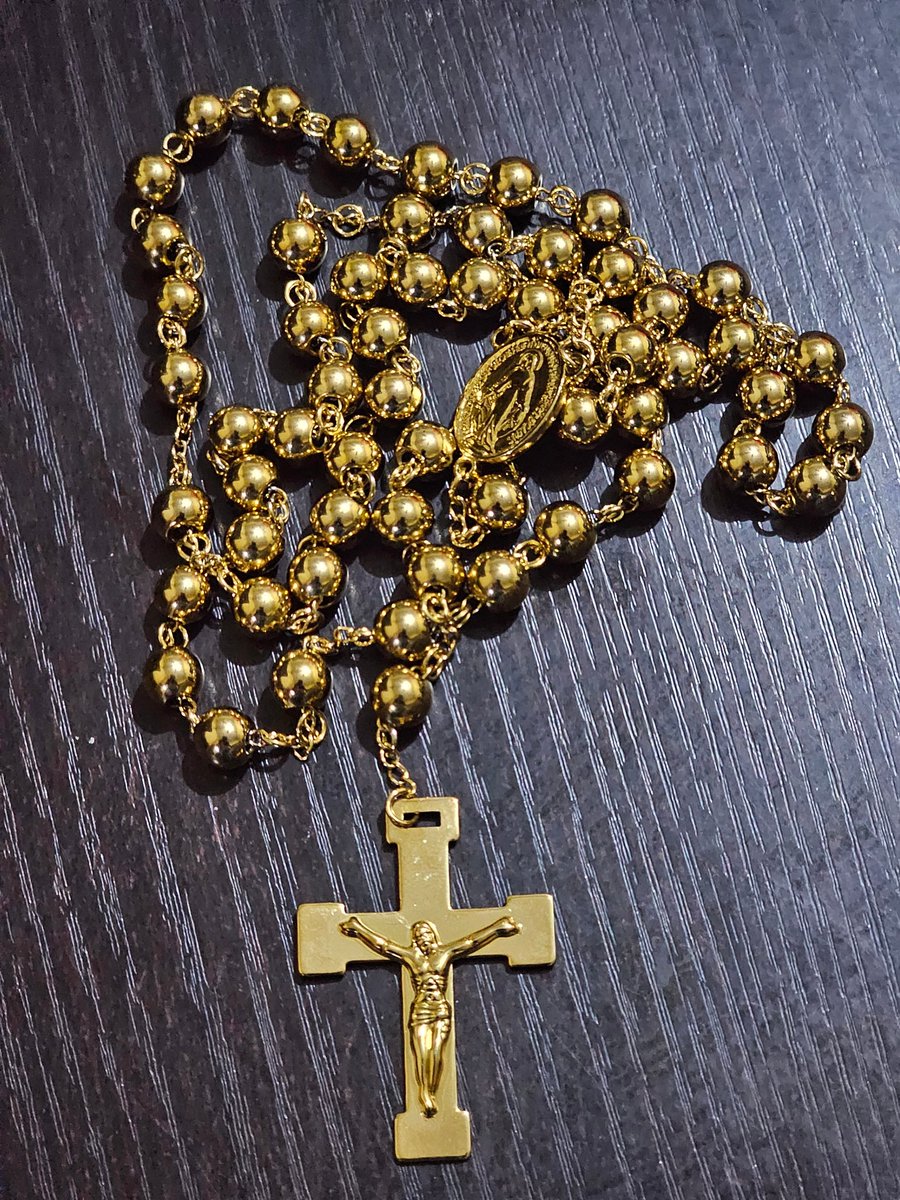 TWEETORACLE's tweet photo. MY FIRST ROSARY MIRACLE 👇👇

Something Miraculous happened to me this afternoon. I always have this Gold rosary in my pocket everywhere I go.

So as I was on site this afternoon and had to record a video for a client and to avoid the rosary jangling in my pocket with that jangling sound which will definitely filter in to the video, I gave the rosary to a colleague to hold for me until I am done shooting the video. I forgot to take it back. 

And the site was quite far out of town like almost 30mins drive from tarred road. I didn't even remember to collect the rosary from her until we got back into town and I was about to alight from the car. Then it dawned on me that I forgot it, I almost panicked, she didn't even remember how and where she kept it . When she killed the engine, we started looking for it, Lo and behold, it was on top of her car all along and the road we passed was untarred, plenty ditches we fell into and gallops for more than 30mins drive and the rosary didnt even fall off.

If you look at how it was kept, you would realize just how much it is unbelievable that the rosary could have stayed on top of the car like that without falling off with all the bad untarred road we passed all along. It is nothing short of a miracle. MOTHER MARY CLEARLY SENT ME A CLEAR MESSAGE WITH THIS ONE TO HANDLE MY ROSARY WITH BETTER CARW ALWAYS 🙏🙏

My rosary, my weapon 💙❤️👇
