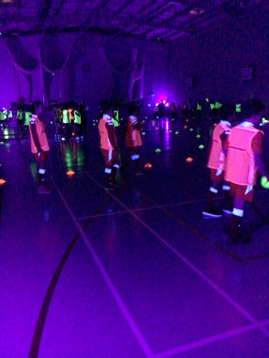 SimonstoneStP's tweet photo. Glow dodgeball was incredible this morning! Well done to our year 6 team who represented us with pride! Our new kits were perfect for the UV lights too! A great morning all round! Thanks @HRVSSP for a fab event! https://t.co/6nHgJN9cfA
