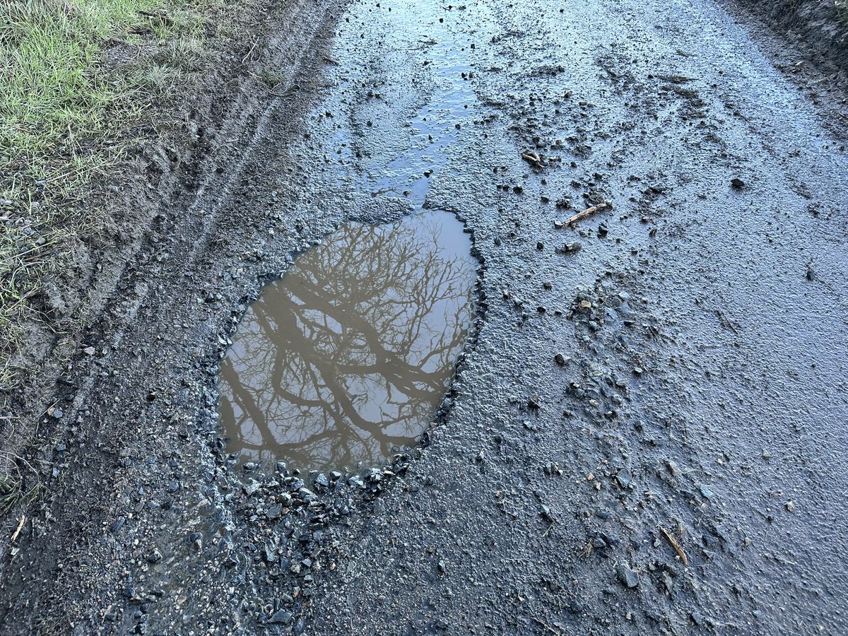 Transport0903's tweet photo. @MorayCouncil what’s the chances of repairing or filling some craters in? Operating school transport up roads like this is just ridiculous https://t.co/CeROPRVnZa