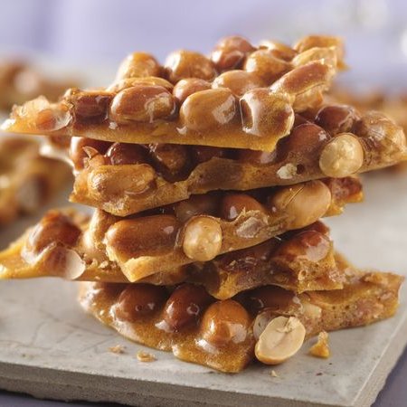 Crunching into the sweetness of #PeanutBrittleDay! 🥜🍬 A perfect blend of sugary crunch and nutty goodness. What memories does peanut brittle bring to mind for you? Share your sweet moments or any unique twists you add to this classic treat! 😋✨ #PeanutBrittle #Sweets