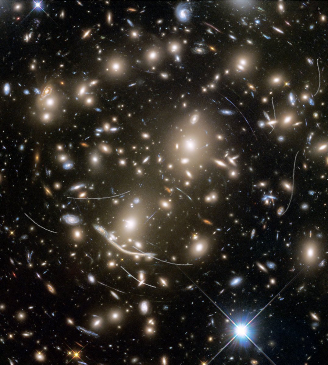 Hubble telescope deep field photo of the entire universe, with streaks which are asteroids