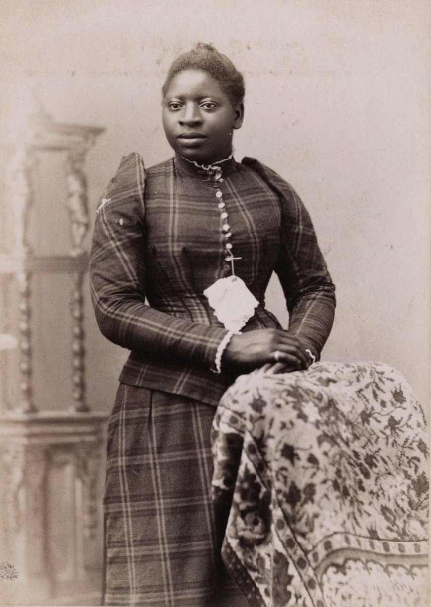 A wonderful cabinet card showing a beautifully tailored plaid ensemble, with the very beginnings of the resurgence of the puffed sleeve fashion, which so obsessed Anne Shirley. Photographed by Fisher &amp; Monfort in Plainfield, New Jersey, ca. 1890-1892. The identity of the lady is