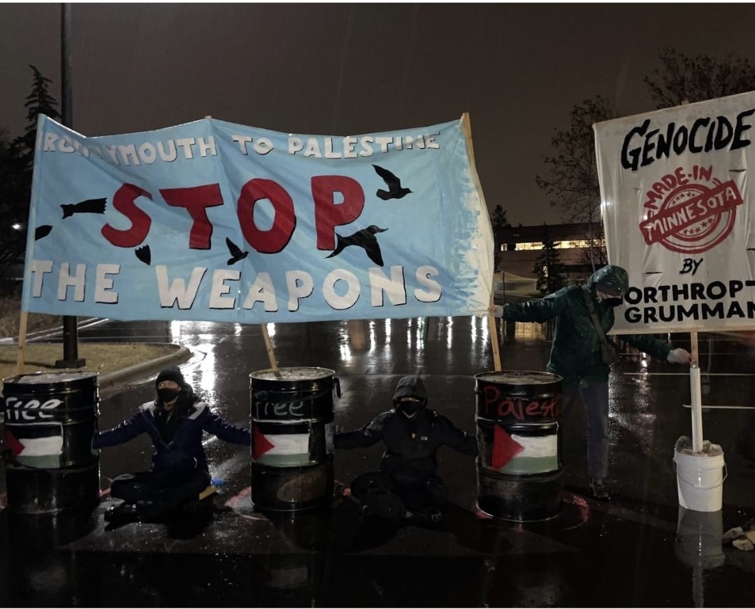 Submitted: Today activists blocked <a href="/northropgrumman/">Northrop Grumman</a>  in Plymouth, MN. Activists chained to barrels to shut down work as NG as profits off of genocide in Palestine.