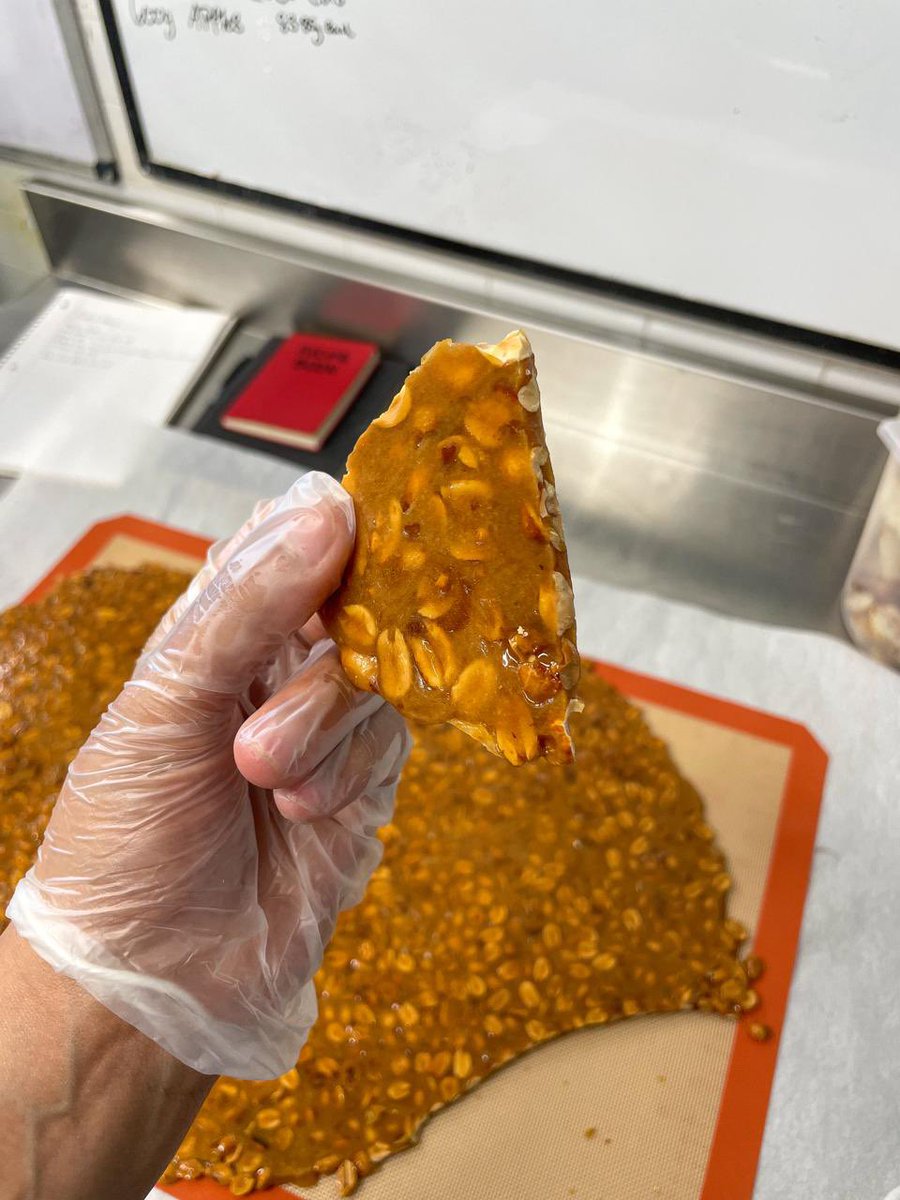 Chocolate &amp; Caramelized Peanuts
NEW FLAVOR FOR THE MONTH OF FEBRUARY
24 hr raised brioche dough, dipped in an all new dark chocolate glaze, then coated in our homemade peanut brittle, topped with a hand piped chocolate ganache and finished with a chunk of the peanut brittle