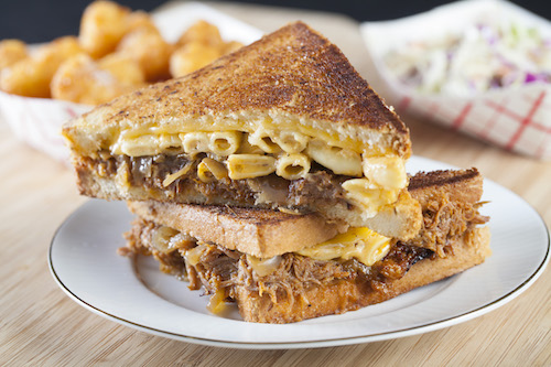 We take  BBQ pulled pork &amp; southern mac and cheese, put that in between  <a href="/Tillamook/">Tillamook</a> sharp cheddar, throw in caramelized onions - add bread and butter, grill it until golden brown to make... HEAVEN.
Who' wants a #CheesyMacandRib???
<a href="/ogcannabiscafe/">Original Cannabis Cafe</a>  Feb 20th