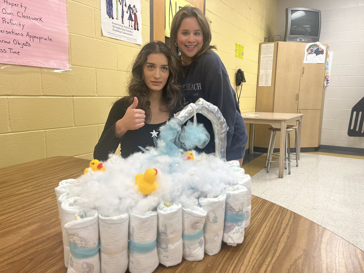 GileGina's tweet photo. What’s a diaper cake? Now you know! Child Development had fun creating diaper cakes for our Teacher Guest Speaker tomorrow. Is it a boy or girl? @SocasteeHS https://t.co/D3ckKGHVme