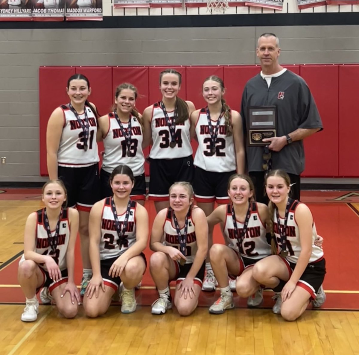 NORTONPRIDE's tweet photo. League champs 8th and Varsity. Tonight in the win at Ravenna. So. Dakota Graham 15pts 4 asst.  Sr. Andie Osolin 14pts, 5 reb Fr. Alivia Goff 12 pts 3 blks. Jr. Olivia Farrell 7pts in the win. Fr Alyssa Messer’s 1st varsity basket🔥🔥 https://t.co/B8G1GE4oiL