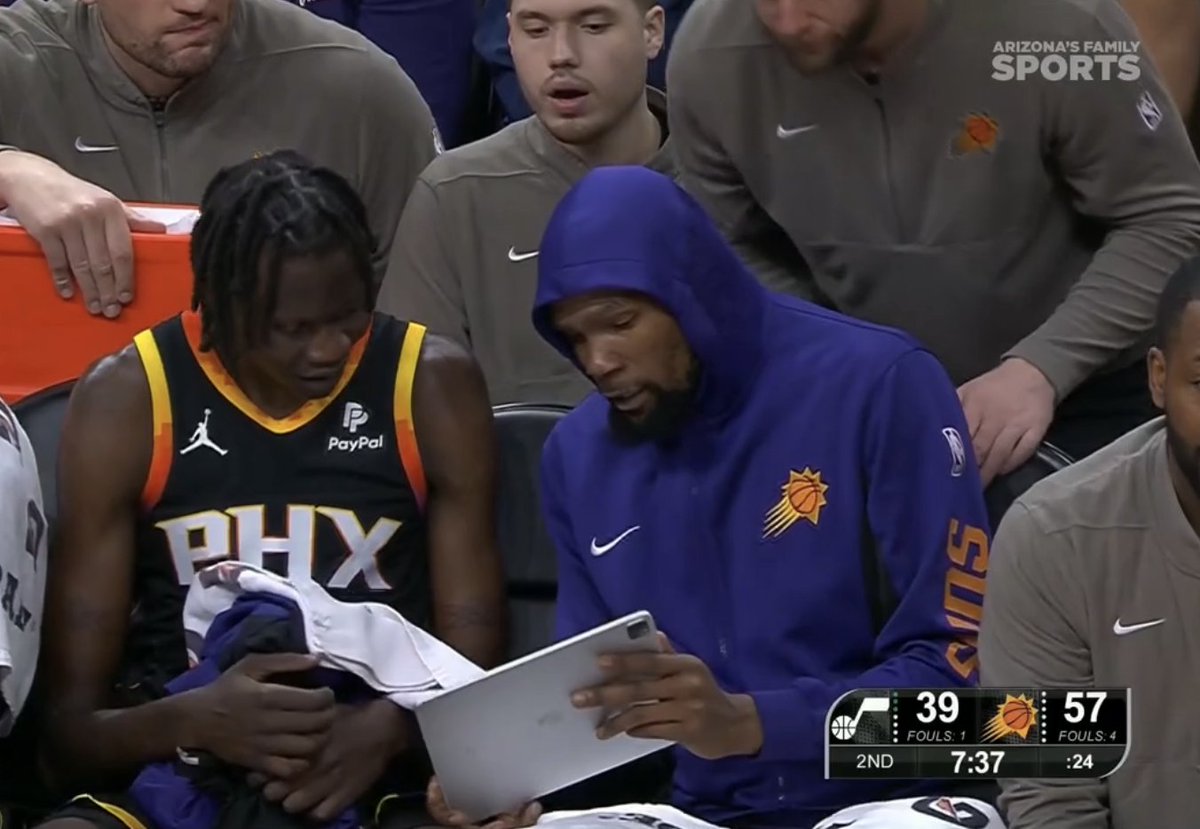 YoungNBA's tweet photo. Kevin Durant film session during the game. Bol Bol learning from a GOAT. https://t.co/4CEqYSw1Bw