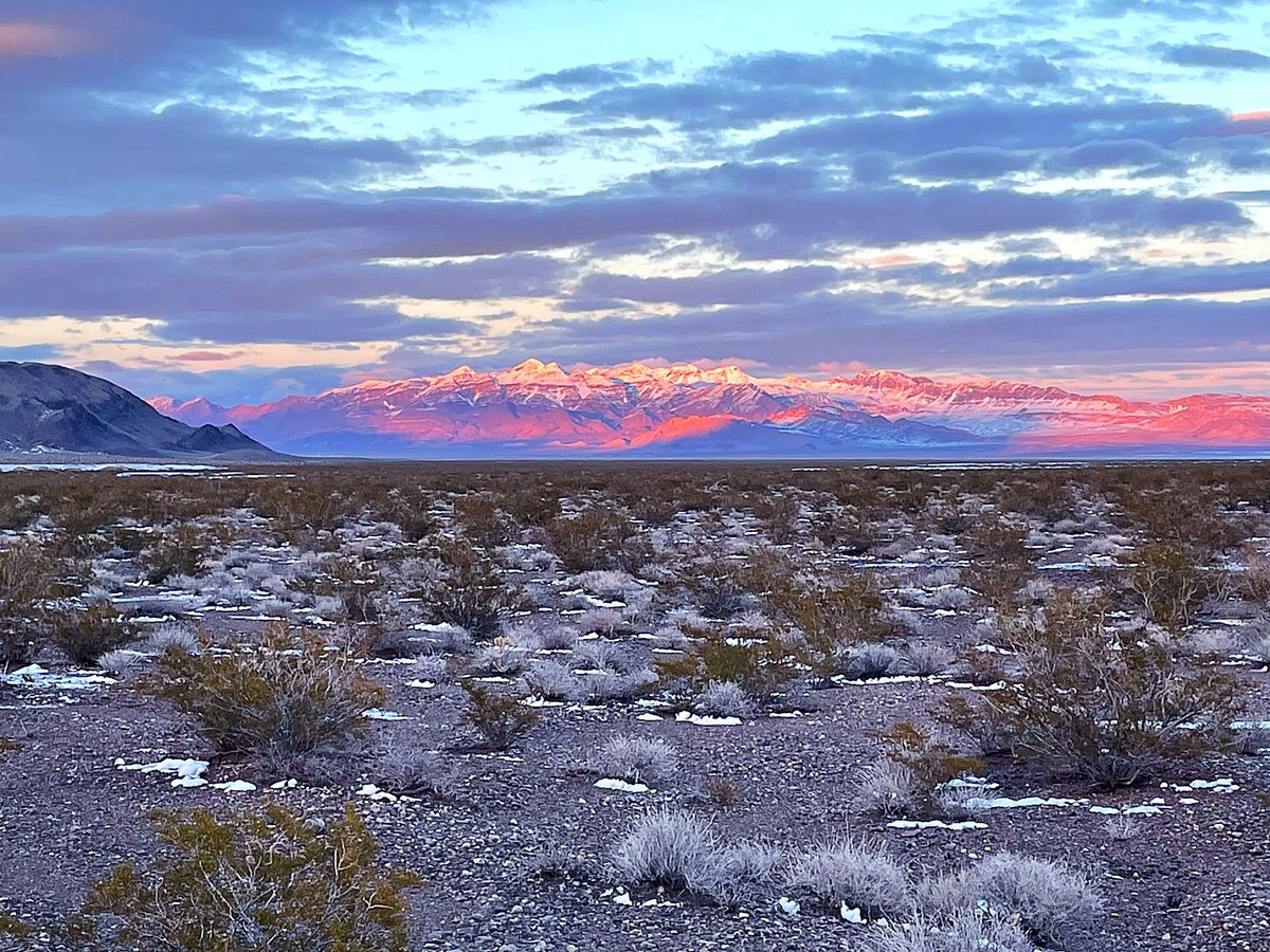 Had to go to Vegas today for errands. Crazy blizzard snow dump this morning just before we drove thru, thick snow at Cactus Springs. Snowplows working on 95, car slid off highway. On way home most snow melted, amazing sunset light on Sheep Range #MojaveDesert #weather