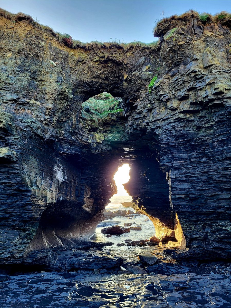 cormac_mcginley's tweet photo. Rising Sun illuminating a Sea arch beneath a blowhole. 
County Clare, Ireland. https://t.co/AhODAJkSWQ