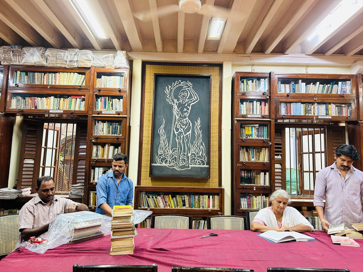 'Library at work'  with the backdrop of Nandlal Bose's painting of Gandhiji depicting communal riots in Noakhali 1946. #ManiBhavan #Library