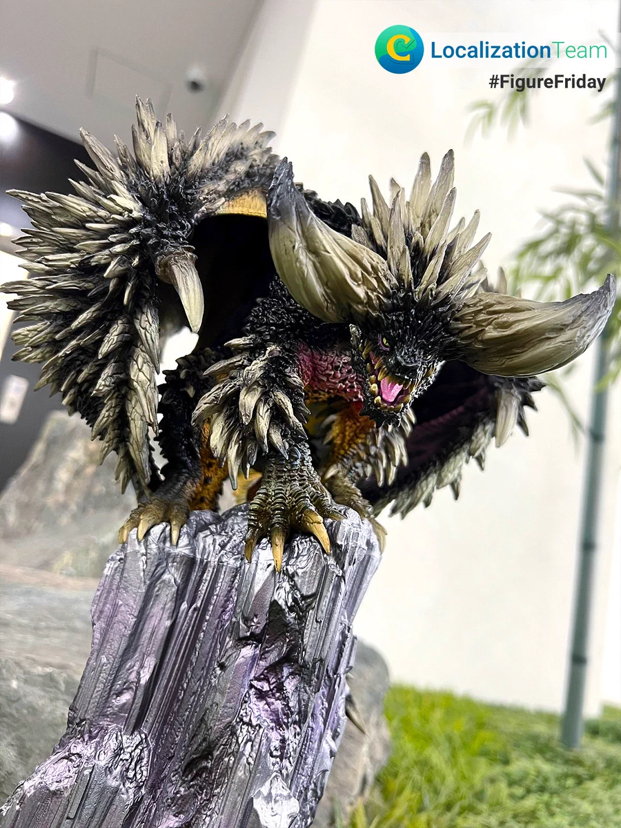 The image features a Nergigante figure from the Monster Hunter video game franchise, standing on a miniature rock formation. On the top right corner, the Capcom Localization Team logo with the hashtag "#FigureFriday".
