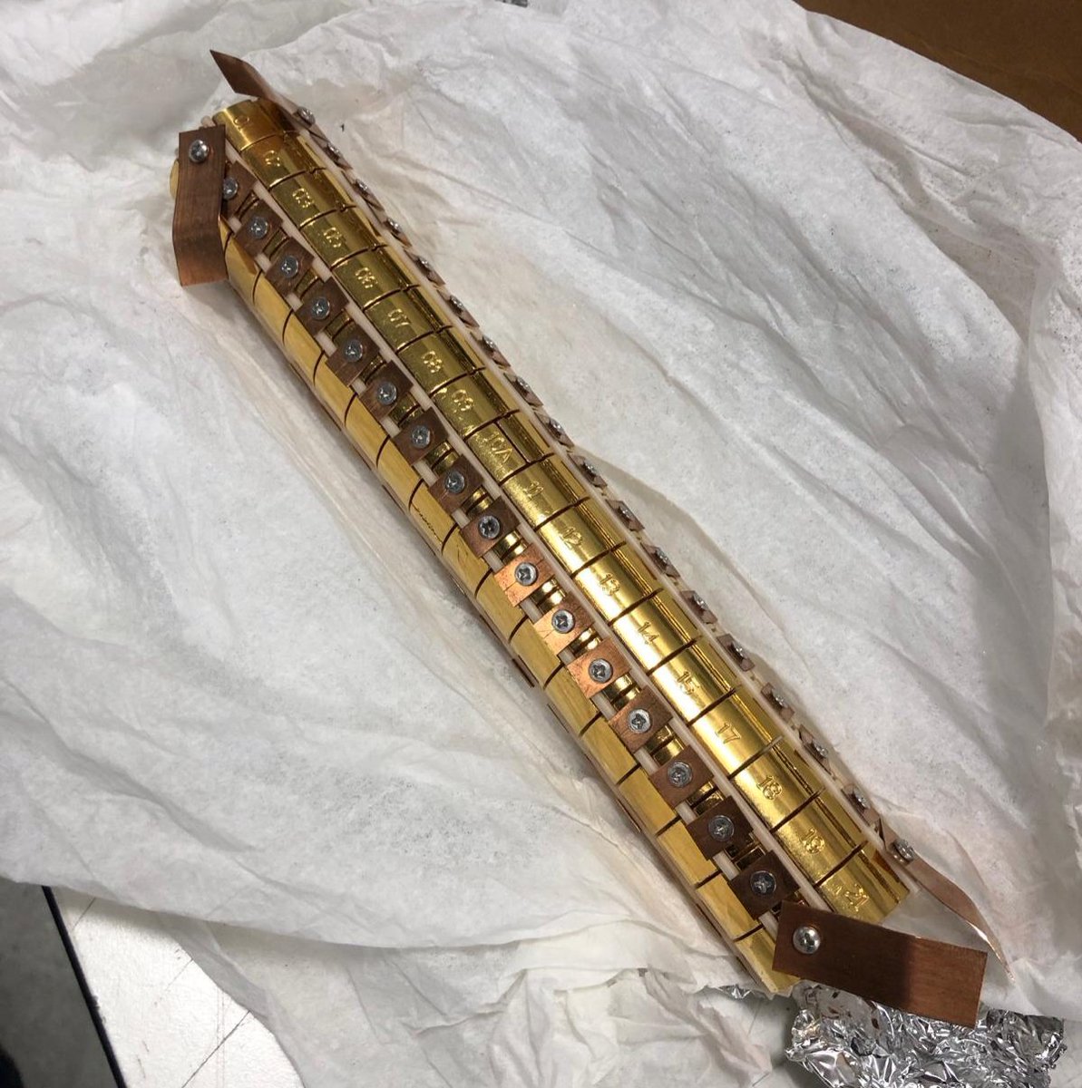 This is a positron accumulator. The ring electrodes are biased to #trap the charged #antimatter in the centre, building up more and more #positrons. The electrodes are #gold plated to give very uniform electric fields. #physics #science #experiment #research #PhD #particlephysics