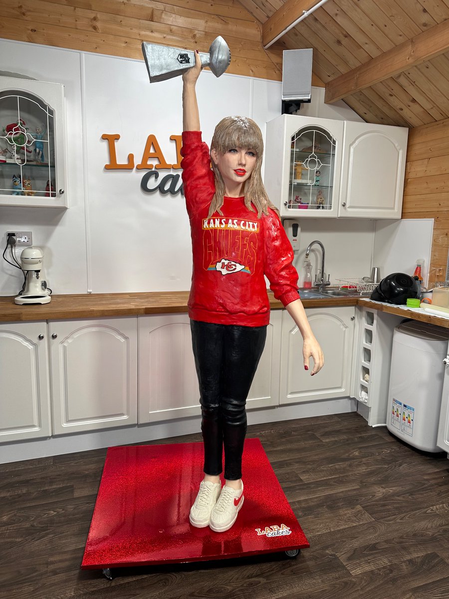 lara_cakes's tweet photo. I made a Lifesize cake of @taylorswift13 in a @Chiefs sweater holding up the @NFL Super Bowl trophy. What do you think?! https://t.co/QQbvNKQC6M