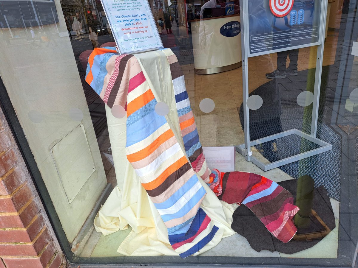 Walton on Thames WI has made a climate scarf, displayed in the window of their local @Nationwide The scarf depicts the rise of temperature from 1919 to 2019, one stripe per year, and they ask ‘how long until it’s all black?’ @WomensInstitute