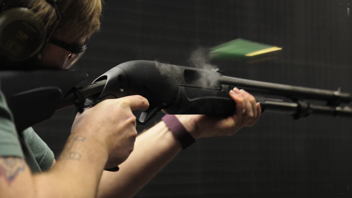 BULKHEAD Animator firing a gun at the shooting range [With professional guidance]