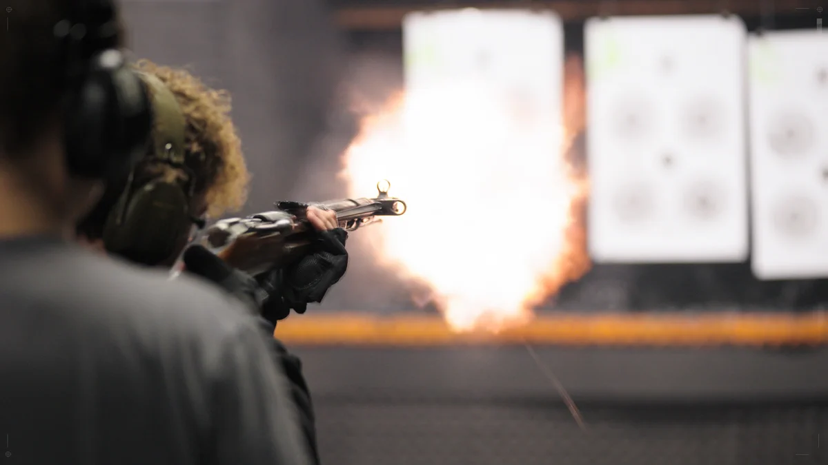 BULKHEAD Designer firing a gun at the shooting range [With professional guidance]