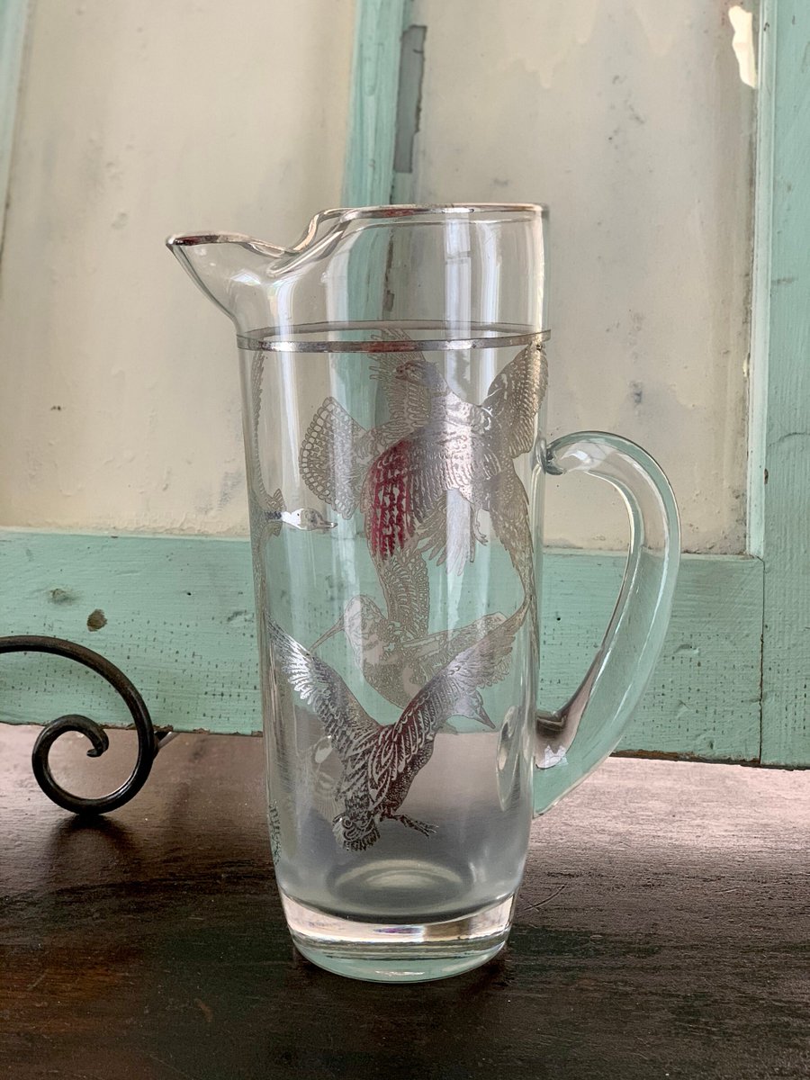VSeagrape's tweet photo. Sleek sellouts! 🤓. Order Pitcher, Vintage Glass Cocktail Pitcher with Silver Birds of Prey Pattern, Vintage Bar, Midcentury Bar Display, Vintage Serving Pitcher at $72.00 from https://t.co/jrYqdhosGf #VintageBar #VintageServing https://t.co/lymgUmV4WH