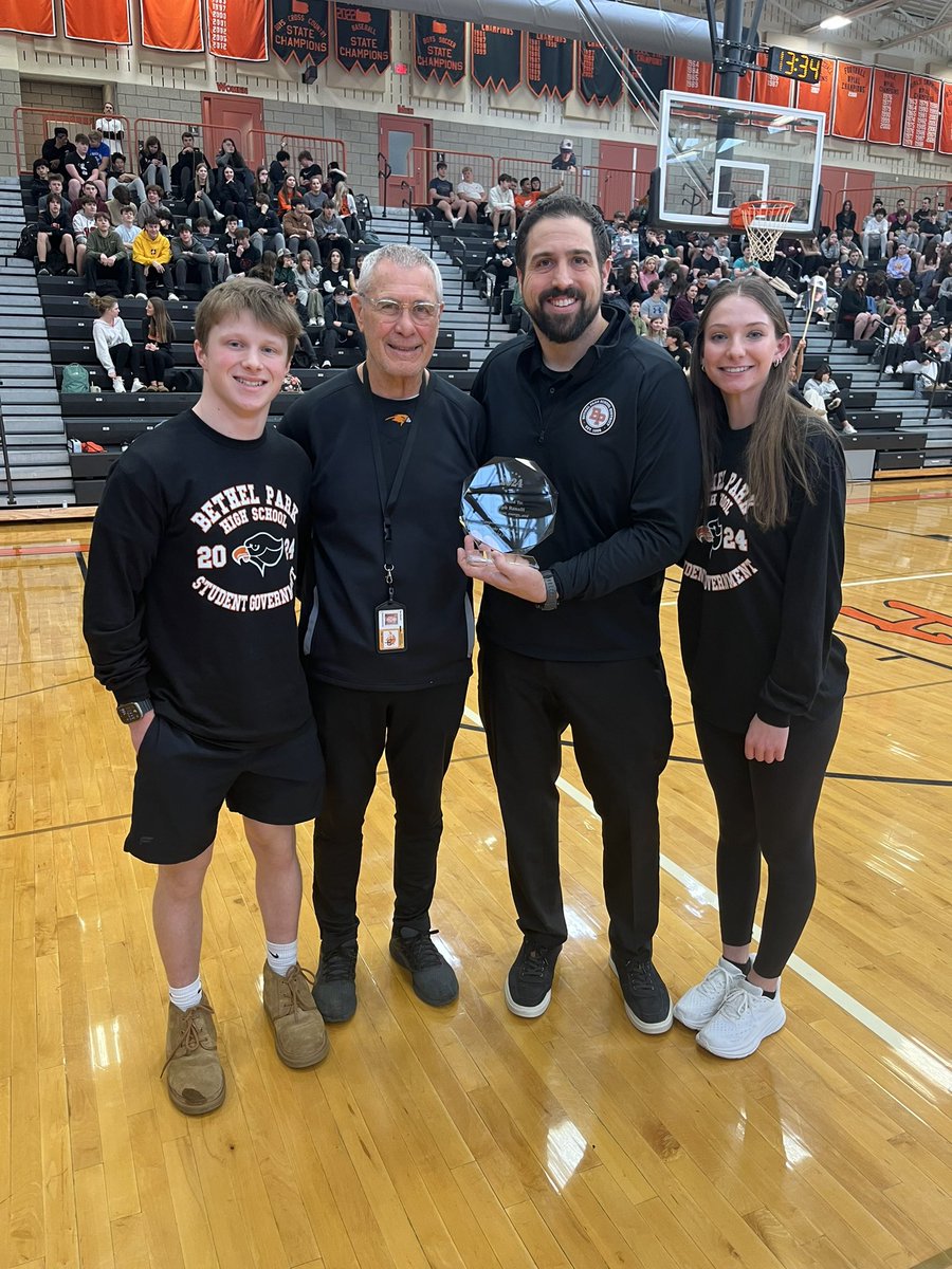 bpsdinfo's tweet photo. Earlier today, Bethel Park High School held its winter sports pep rally. “Coach Joe” Ranalli, a longtime multi-sport coach at the school received a service award.   #bpproud🖤🧡 https://t.co/iWpPwVoZNj