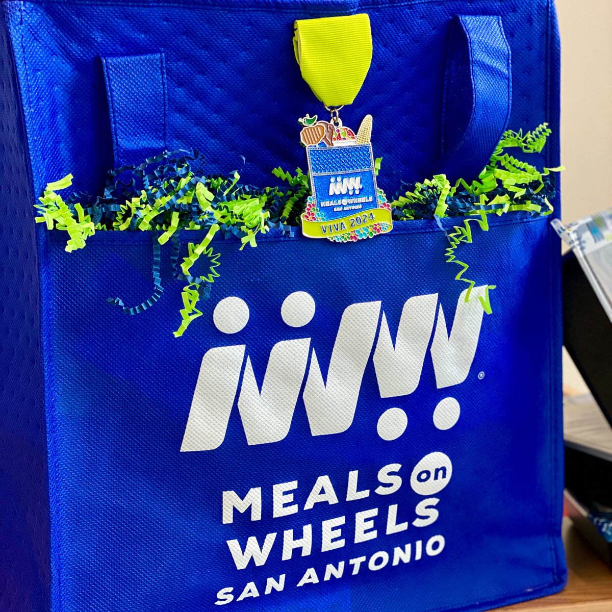 We are excited to release our 2024 Fiesta Medal! This year, the medal features our iconic blue Meals on Wheels bags! We are selling the medal for $14, the cost of two meals delivered to our older and disabled neighbors. Click the link to buy yours today: bit.ly/mowfiestamedal…