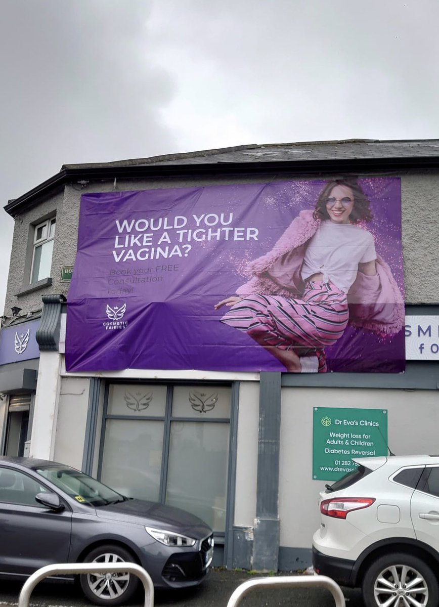 Fanny tightening on the Crumlin Road, Dublin. Ya gotta love the subtle advertising 😂