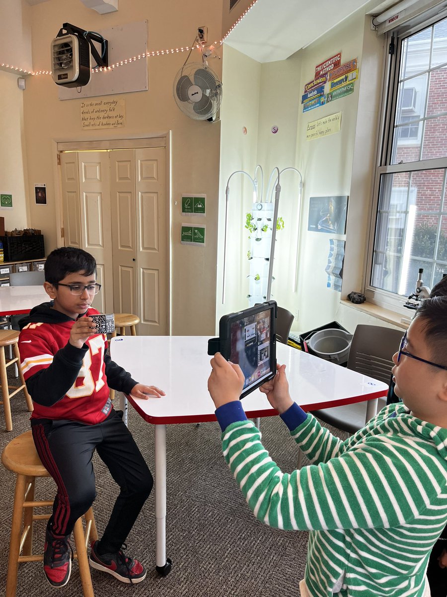 YaelGogolev's tweet photo. The amazing Mr. Kupstas making wonderful use of library resources showing 4th graders the earth 🌎 processes unit on @MergeVR a awesome 👍 supplementary curriculum learning resource #ewlearns @NorthSideEW #VirtualReality #AugmentedReality #mergecube #nextgenerationlearning https://t.co/Shoxt97bJj