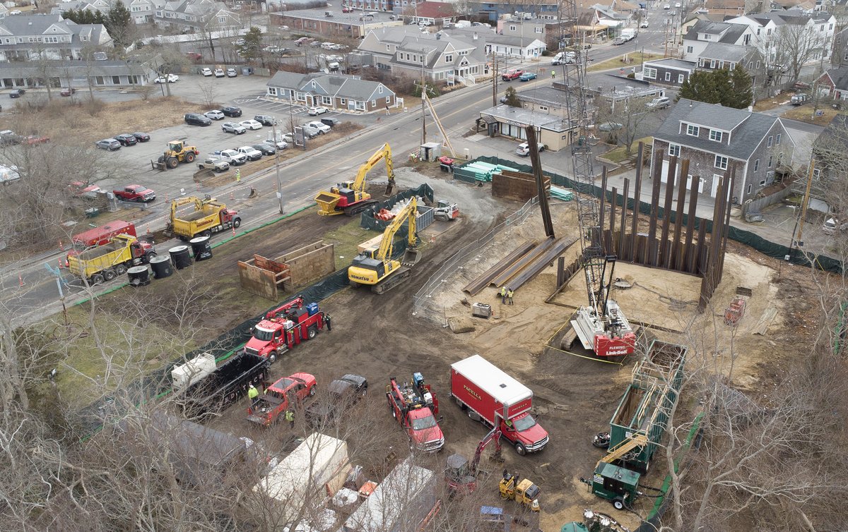 cctphoto's tweet photo. A crane lifts sheet piling into place along the foundation of a new sewer pumping station at the west end of Main Street Hyannis, where the road is also closed for sewer pipe trenching at left. @capecodtimes https://t.co/ockQSJYbFk