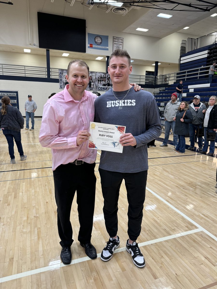 JCCBoysBB's tweet photo. Tonight we also got to honor an impactful alumni, @VossRudy 

Rudy is our all time leading scorer with over 2,100 points and he was a member on our 2017 and 2020 state tournament teams. Many of our current players grew up watching and being inspired by Rudy. https://t.co/GT9SXSnKOi