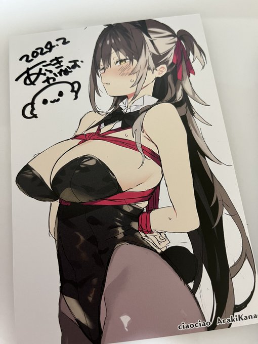 サイン書いてます 