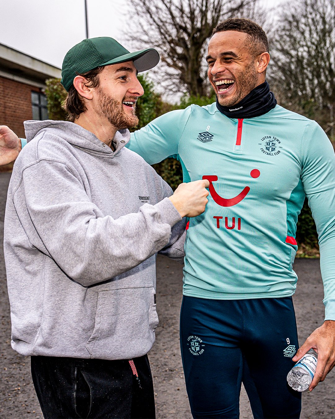 Tom Lockyer and Carlton Morris smiling at the Brache.