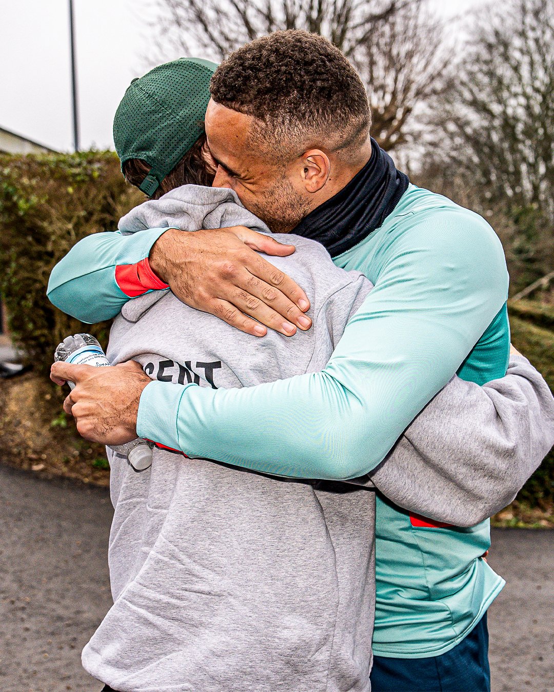 Tom Lockyer and Carlton Morris hugging at the Brache.